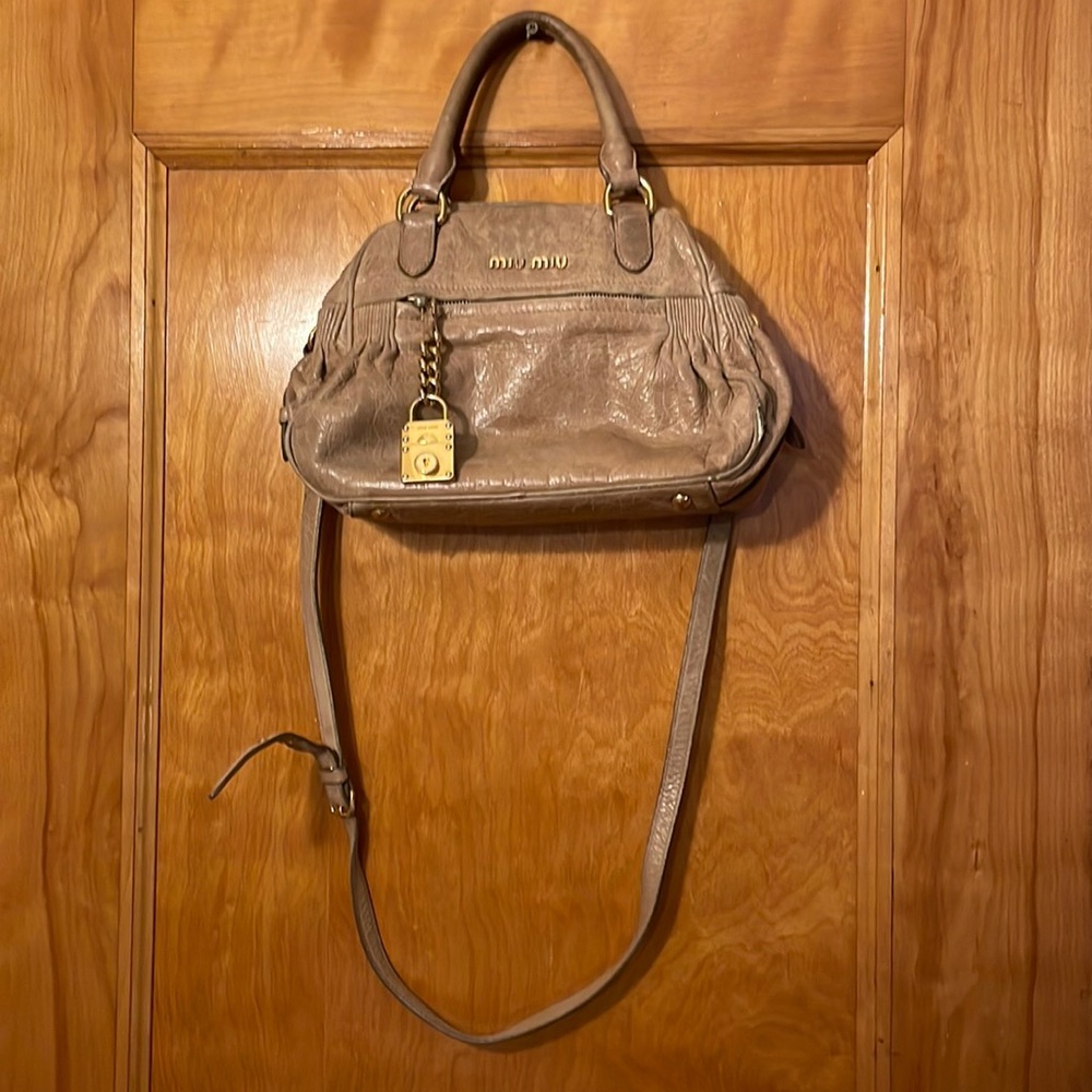 Miu Miu tan and gold handbag
